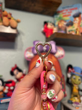 Load image into Gallery viewer, Croissant Cutie Beaded Bag Charm | Aesthetic Girly | Pink Girly Bag Charm | Motel Keychain with Gold Accents |
