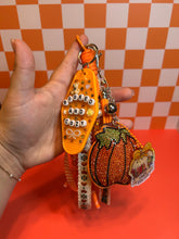 Load image into Gallery viewer, Booked &amp; Cozy Bag Charm | Fall Season Bag Charms | Cozy Book Club Pumpkins Beaded Rope | Rhinestone Pumpkin | Bookish Fall Girly
