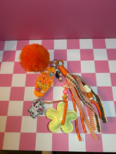 Load image into Gallery viewer, Pua Signature Bag Charm | Tropical Princess Sidekick | Acrylic Charms | Faux Leather Flower | Pom Pom Orange Ocean
