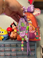 Load image into Gallery viewer, Cute, But Sassy Bag Charm | Pascal + Rapunzel | Castle Inspired Bag Charms | Purple and Green Bag Charm | Magic Inspired
